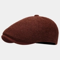 Detail of dark brown newsboy cap showing wool blend texture and suede brim finish - Rust red