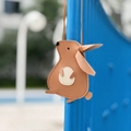 Detail view of the brown leather rabbit pendant bag with premium stitching and zipper - Rabbit Sand Brown