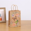 Brown kraft paper gift bag with butterfly and floral prints on a wooden table - H21*L15*W8 / 703-4 Orange & Green Butterfly Rose