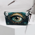 Detail of waterproof Evil Eye makeup bag with gold embroidery on teal fabric texture - Teal Artistic Big Eye