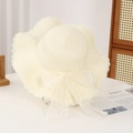 Summer straw sun hat in cream white with wavy brim and lace bow for beach vacation - Lace Water Grass Creamy White
