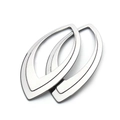 Macro view of teardrop hollow metal earrings in silver finish on a white background - Hollow Teardrop Pendant 23.5mmx47mm
