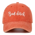 Close-up of Bad Bitch embroidery on washed orange denim cotton baseball cap - Orange