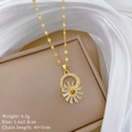 Detail of sunflower pendant with zircon inlay on gold chain against soft fabric - Sunflower Necklace (Titanium Steel Chain Copper Pendant)