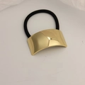 Minimalist ponytail holder with a polished gold curved metal plate and black elastic band - Square Glossy Gold