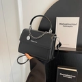 Elegant black leather handbag with silver chain and white Fashion & Bags text logo - Black