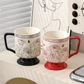 Detail of red and black ceramic mugs featuring rose and butterfly patterns with Simple Love text - Red & Black Couple Mugs Set