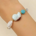 Detail of seashell and turquoise bracelet with freshwater pearls and rhinestones on wrist - KC Gold Turquoise (8904)