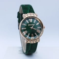 Detailed view of dark green leather strap and crystal lugs on the rose gold watch - Green