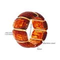 Detail view of amber resin and stainless steel cuff showing 4.1cm width and 6cm diameter - 60mm / Amber (E679)