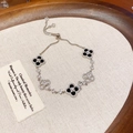 Silver four-leaf clover bracelet with black stones and sparkling cubic zirconia charms - Silver/Black