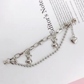 Detail view of silver metal chain bracelet with heart and bear charms on paper background - K288 Metal Double Chain (Bear)