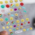 Detail view of 3D embossed nail stickers featuring colorful smileys and heart patterns - TS-644 Sunshine Smiley Face