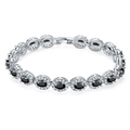 Detail of silver-tone bracelet featuring black oval stones and halo diamond settings - Platinum Black Zirconia