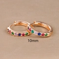 Close-up of 10mm rose gold hoop earrings with multi-color cubic zirconia stones - 10mm / Rose Gold