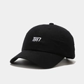Detailed close-up of 1987 white embroidery on black cotton twill baseball cap - M (56-58cm) / Black