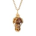 Detailed view of handmade gold wire-wrapped tiger eye stone mushroom pendant necklace - Lilac Stone