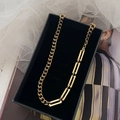 Gold-toned titanium Cuban link and rectangular chain necklace in a velvet jewelry box - Necklace / Gold