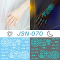 Luminous temporary tattoo JSN-070 with white moon and star pattern glowing in cyan blue - JSN-070 (Geometric Lantern Moon)