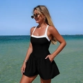 One-piece black and white contrast swim dress with practical side pockets on beach - S / Black