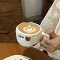 Handcrafted ceramic mug featuring a cute brown bear pattern and irregular cloud-like shape - Bear