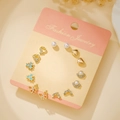 7-piece Korean titanium steel earring set in gold with heart butterfly and pearl charms - Gold Heart Star Butterfly (E1918-1)