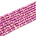 Detailed macro view of purple marbled heishi beads showing natural texture and disk shape - Purple