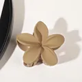 Matte beige plumeria flower hair claw clip with sturdy teeth on a white background - Matte Milk Coffee