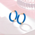 Blue enamel huggie hoop earrings with golden finish on a white geometric stand - Sky Blue