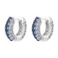 Macro view of silver hoop earrings with blue and white zircons in pave setting - Platinum Blue Zirconia