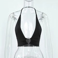 Close-up of black halter top with deep V-neck and silver metal ring connector detail - S / Black