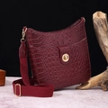 Detail of burgundy crocodile-embossed leather bag with canvas strap and gold buckle - Crocodile Pattern Set (PG867) / Grape Red