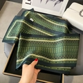 Green silk scarf with floral patterns displayed in a premium black gift box set - Green Bahrain Leaf