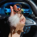 Star-shaped keychain with gold crystals and white faux fur pompom for car keys - Champagne