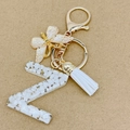 Letter Z keychain with white stones, gold foil, butterfly charm and white tassel - Letter Z