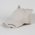Detail of light beige baseball cap featuring cat ears with metal studs and printed text - Style 36-Beige Cat Ears Rivet