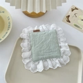 Close-up of light green fabric coaster with white ruffled lace and heart patterns - Mint Green