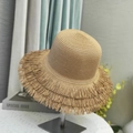 Detailed close-up of straw sun hat featuring a unique fringed edge and woven texture - Small / Khaki