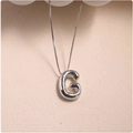 Detailed close-up of a silver balloon style letter G pendant with realistic texture - Silver (With Necklace) G