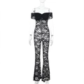 Detailansicht der aufwendigen schwarzen Spitzentextur und Blumenmuster am Jumpsuit - S / Schwarz