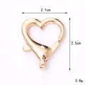 Macro view of heart-shaped rose gold zinc alloy lobster clasp with dimensions and weight - 25mm Heart Lobster Clasp / Gold