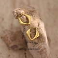 Detailed view of gold irregular earrings with dimensions of 2.4cm by 2.2cm on stone - Irregular Geometric (EH149) / Gold