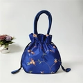 Detailed embroidery on blue satin drawstring bucket bag with floral pattern - Royal Blue