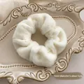 White faux fur scrunchie with 5cm inner diameter on a vintage ceramic tray - Fuzzy Texture