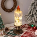 Détail de bougie LED de Noël avec ange doré, paillettes scintillantes et socle antique - Style d'Ange