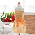 Close-up of orange and white plaid pet princess dress with a large orange satin bow detail - Yellow Check