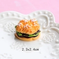 Detailed view of a 2.3x2.4cm miniature resin burger model on a white decorative plate - Cream Sandwich