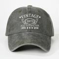 Detail of vintage 1973 printed text on washed cotton baseball cap with retro distressed look - One Size / Army Green
