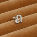 Macro view of silver stainless steel heart cartilage stud with micro-pave zircons - Heart