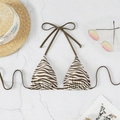 Halter bikini top with brown zebra print and adjustable neck ties on stone background - Coffee Zebra
